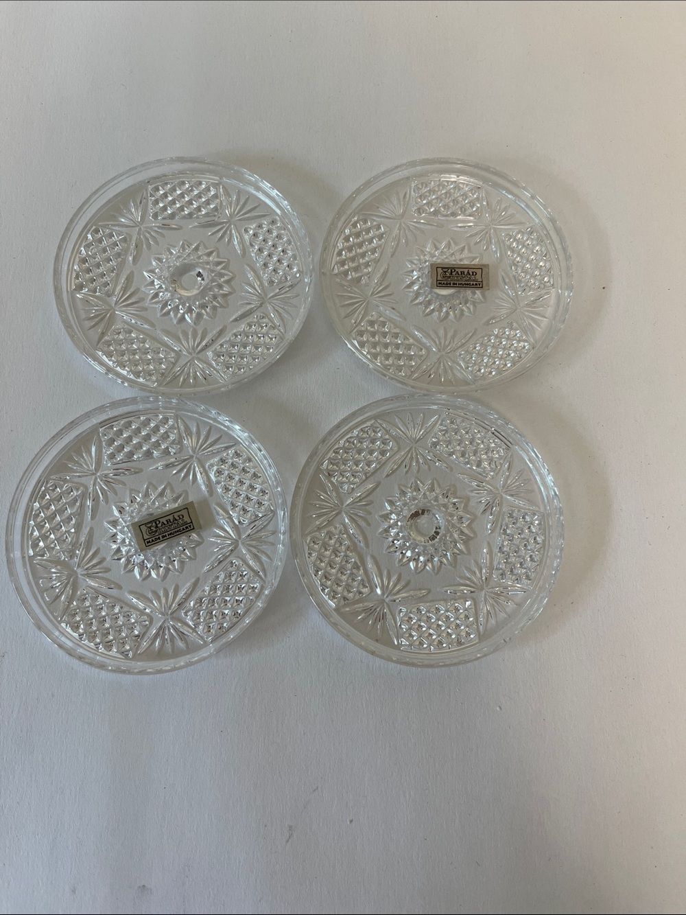 Crystal mouth blown coasters, a set of four